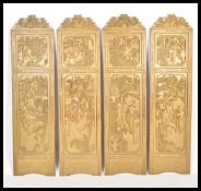 An early 19th Century Chinese Qing Dynasty four panel discretionary screen having brilliant carved