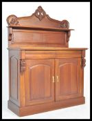 A Victorian 19th century style mahogany chiffonier sideboard. Raised on a plinth base with twin door