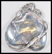 A WMF Art Nouveau electroplated card dish in the form of a maiden with long hair with floral