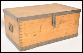 A 19th Century pine trunk coffer chest box having wrought iron drop handles and being wrought iron
