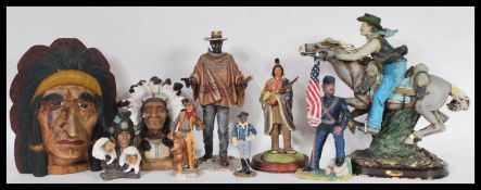 A collection of resin figures of Native Americans and Cowboys to include figures from the academy