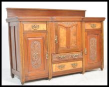 A 19th Century Victorian walnut and mahogany Art Nouveau sideboard credenza having breakfront with