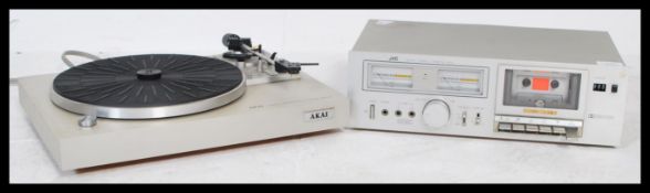 A retro 20th Century Akai AP B10C record deck  together with a JVC KD - A11 stereo cassette deck.