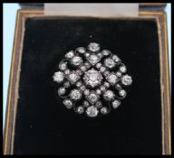 A 19th Century Victorian gold silver and diamond cluster brooch pendant having prong and collet