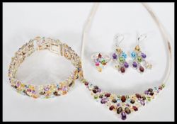 A demi parure set of stamped 925 silver jewellery set with multi coloured gemstones to include