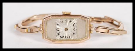 A 9ct hallmarked ladies dress watch/ cocktail wristwatch and expanding 9ct gold bracelet strap.