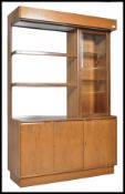 A retro 20th Century teak wood high sideboard credenza display cabinet. The cabinet with three