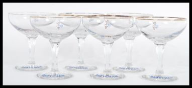 A set of six baby cham glasses having hexagonal stems with the deer logo to each and gilt rims. 10.