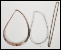 Two flat link silver necklaces and a silver chain, all three being stamped 925. Two having lobster
