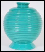 A vintage 20th Century Art Deco mint green ceramic vase of bulbous form having a reeded ripple