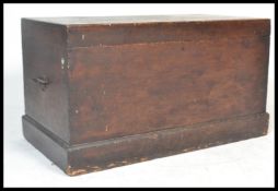 A 19th century Victorian pine blanket box with panelled sides having hinged top with open storage,