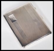 A silver hallmarked cigarette case having an engine turned front and back, Birmingham assay dating