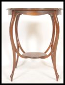 A Victorian mahogany lamp / side occasional table having pie crust top raised on slender supports