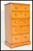 A late 19th / early 20th Century satin walnut tallboy chest on chest, the chest with a configuration