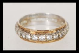 A 9ct gold eternity ring being channel set with multiple white stones, complete in presentation box