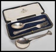 A  silver hallmarked presentation fork and spoon with Sheffield hallmarks together with another