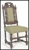 A 19th Century Victorian ebonised Carolean revival barley twist bedroom chair raised on block and