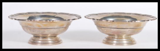 A pair of early 20th Century hallmarked silver bowls by Walker and Hall being hallmarked for