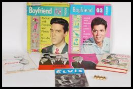 A collection of music memorabilia dating to the 1960's to include a gilt metal Beatles brooch,