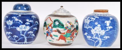 A group of three Chinese porcelain ginger jars to include two prunus pattern examples one with