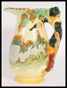A Staffordshire 20th century Burleigh ware Art Deco water jug, having relife Highwayman handle.