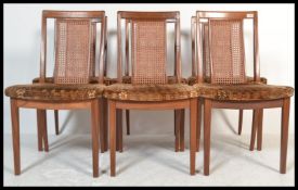 A set of six vintage retro 20th Century G Plan teak dining chairs raised on shaped legs with bergere