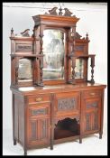 A large Victorian mahogany mirror back sideboard. The base raised on turned legs with a series of
