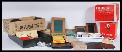 A collection of vintage 20th Century photographic accessories to include boxed glass photographic