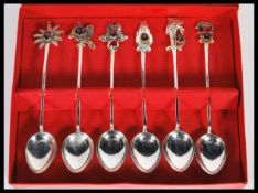 A set of six cased Sri Lanka silver teaspoons, each having a Ruby coloured stone in a claw