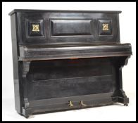 A 19th Century Victorian ebonised cased upright piano by ' Chappell, London ' iron framed and