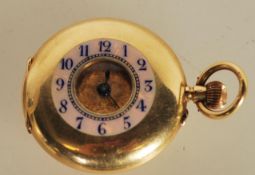 A ladies' 18ct. gold half hunter pocket watch, having white enamel Roman numeral dial, 32mm diameter