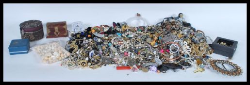 A large collection of vintage mixed costume jewellery to include a wide variety of necklaces, a