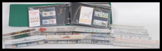 An album of assorted unused decimal stamps / presentation packs. All largely low denomination,