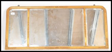 An early 20th Century Edwardian gilt ormolu triptych triple overmantel mirror having three