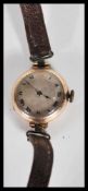 A 9ct gold hallmarked ladies wristwatch/ cocktail watch. Having a circular face with roman numeral