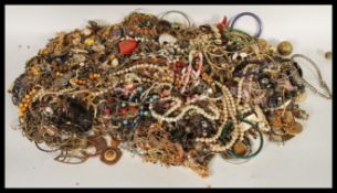 A large selection of vintage costume jewellery to include a wide selection of retro clip on