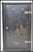 An early 18th Century English Georgian black Chinoiserie lacquer Japanned corner cabinet having gilt