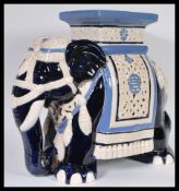 A 20th century large Chinese ceramic planter / stool in the form of an Elephant having painted