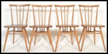A set of four vintage retro 20th century Ercol beech and elm Windsor model 391 dining chairs