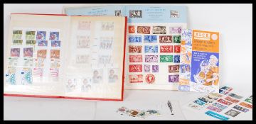 A collection of world stamps, most dating from the mid 20th Century to include stamps from Great
