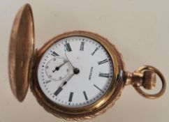 A 14Ct gold full hunter Waltham crown winder pocket watch, enamel face with Roman numeral chapter