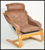A vintage retro 20th Century Star Danish lounge chair raised on bentwood frame with shaped arm rests