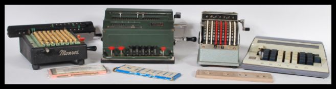A large collection of vintage adding machines to include: Monroe LX-160 (1950), Facet TK (1948),