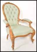 A 19th Century Victorian spoon back mahogany armchair or arm chair raised on ceramic castors with