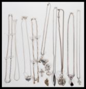 A selection of 925 silver necklaces and necklace pendants on various different chains to include a