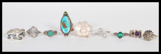 A selection of stamped 925 silver rings to include a ring set with a large oval turquoise stone, a