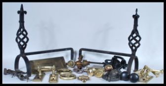 A collection of door furniture to include a Victorian cast iron door knocker, along with a lion mask