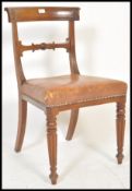 A 19th century Regency Gillows of Lancaster mahogany and leather desk chair.  Fluted and reeded legs