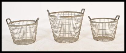 A collection of 3 vintage 20th century Industrial French oyster catcher baskets having loop