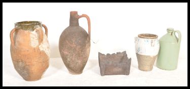 A group of vintage 20th Century stoneware storage jars to include a clay Geek style olive oil jar